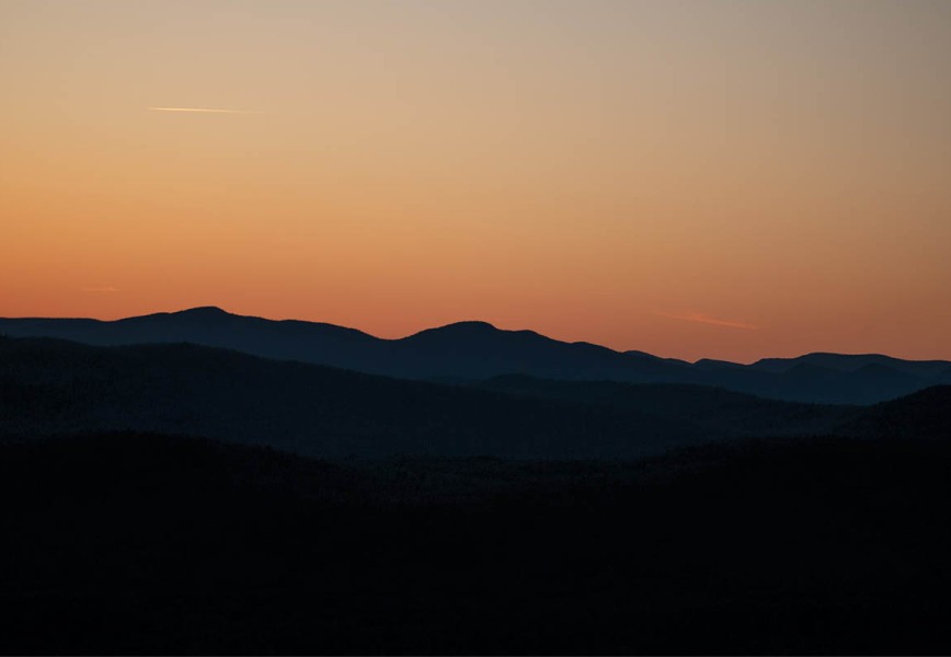 gravel biking with bob olden - a photo of a sunset over mountains