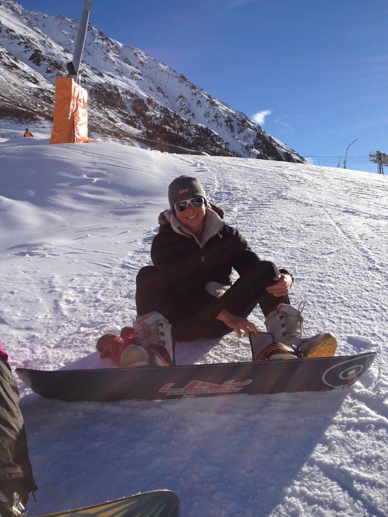 Putting a snowboard on for the first time ever!