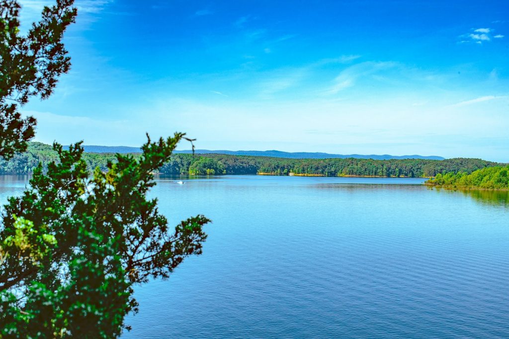 body of water under the blue sky