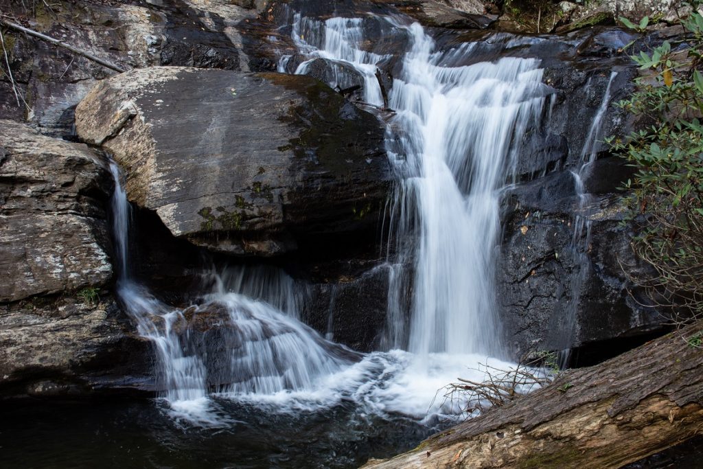 waterfall over gray rock formations