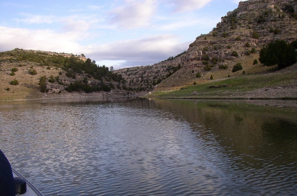 view of body of water surrounded by mountains from boat