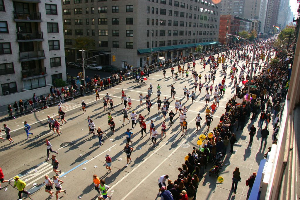 people running down the street in a marathon