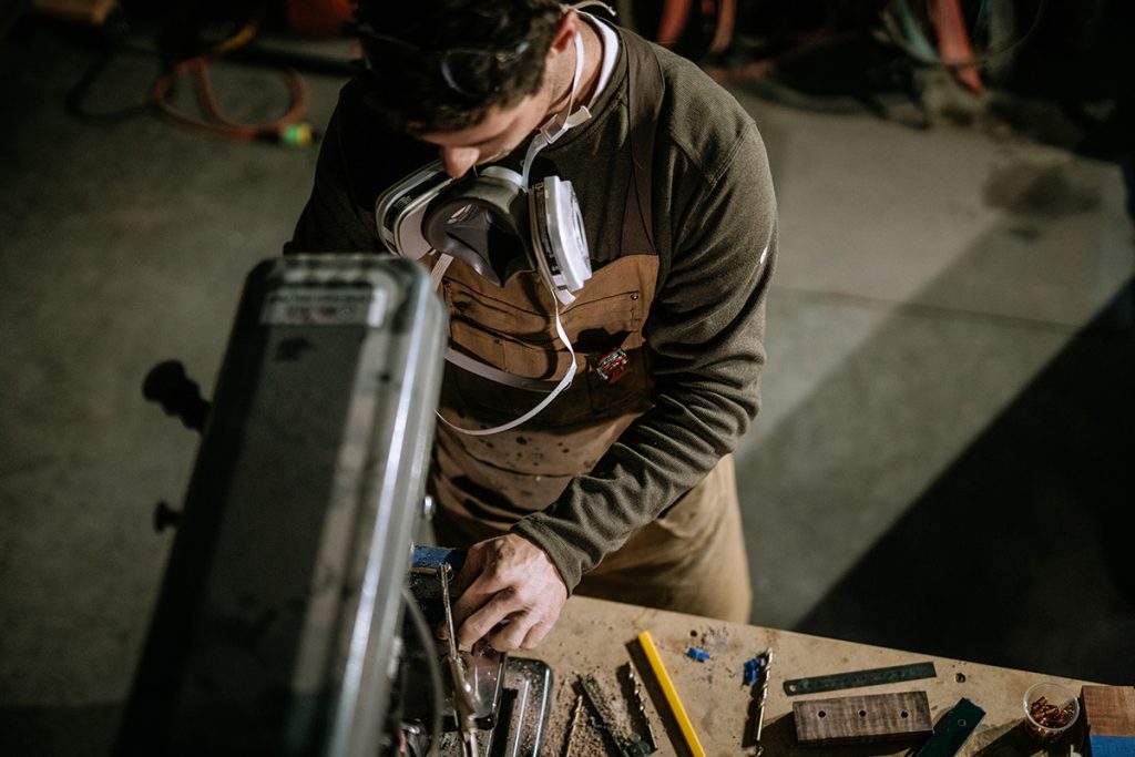 A Man Working In a KONFLIKT™ HENLEY